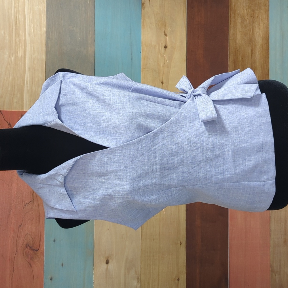 Chic Sky Blue Sleeveless Wrap Blouse